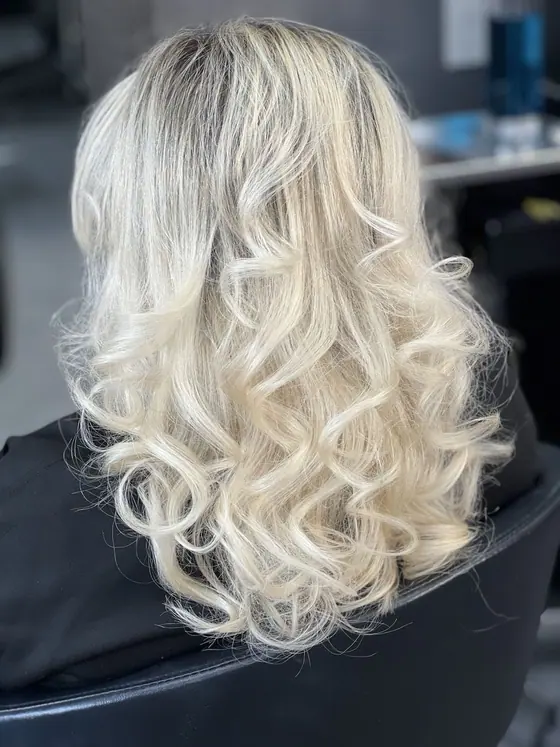 Icy platinum blonde with soft curled ends