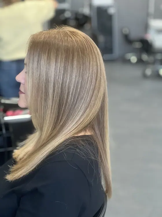 Sleek straight blow dry on cool blonde highlights