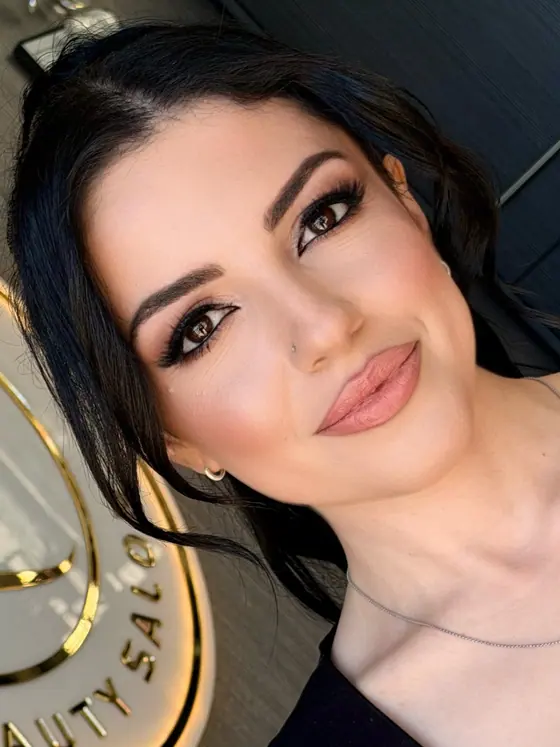 Soft glam makeup with defined eyes and a nude lip