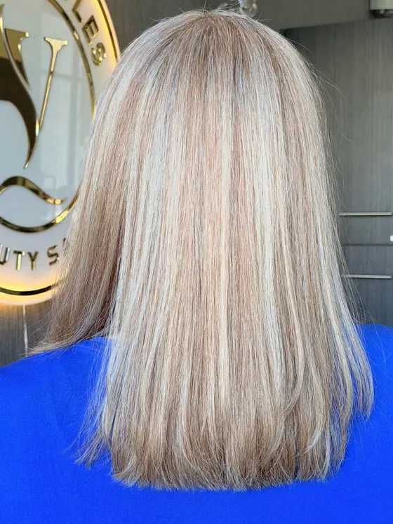 Cool blonde shoulder-length hair with a smooth finish