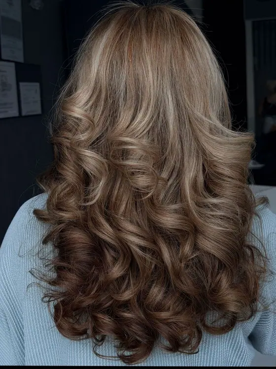 Warm brunette balayage with long curls