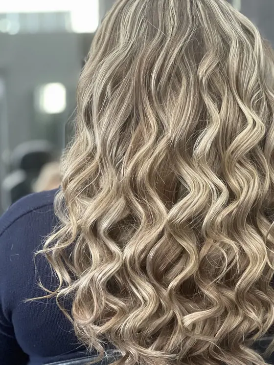 Blonde hair styled in defined spiral curls