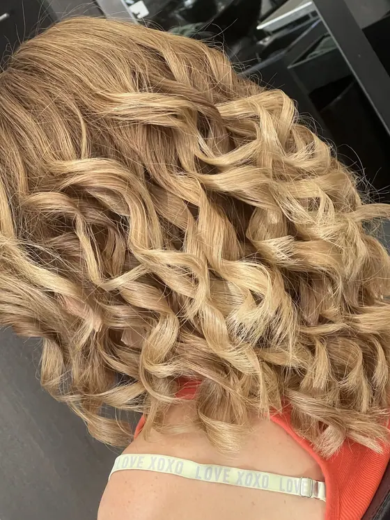 Short blonde curls with plenty of body